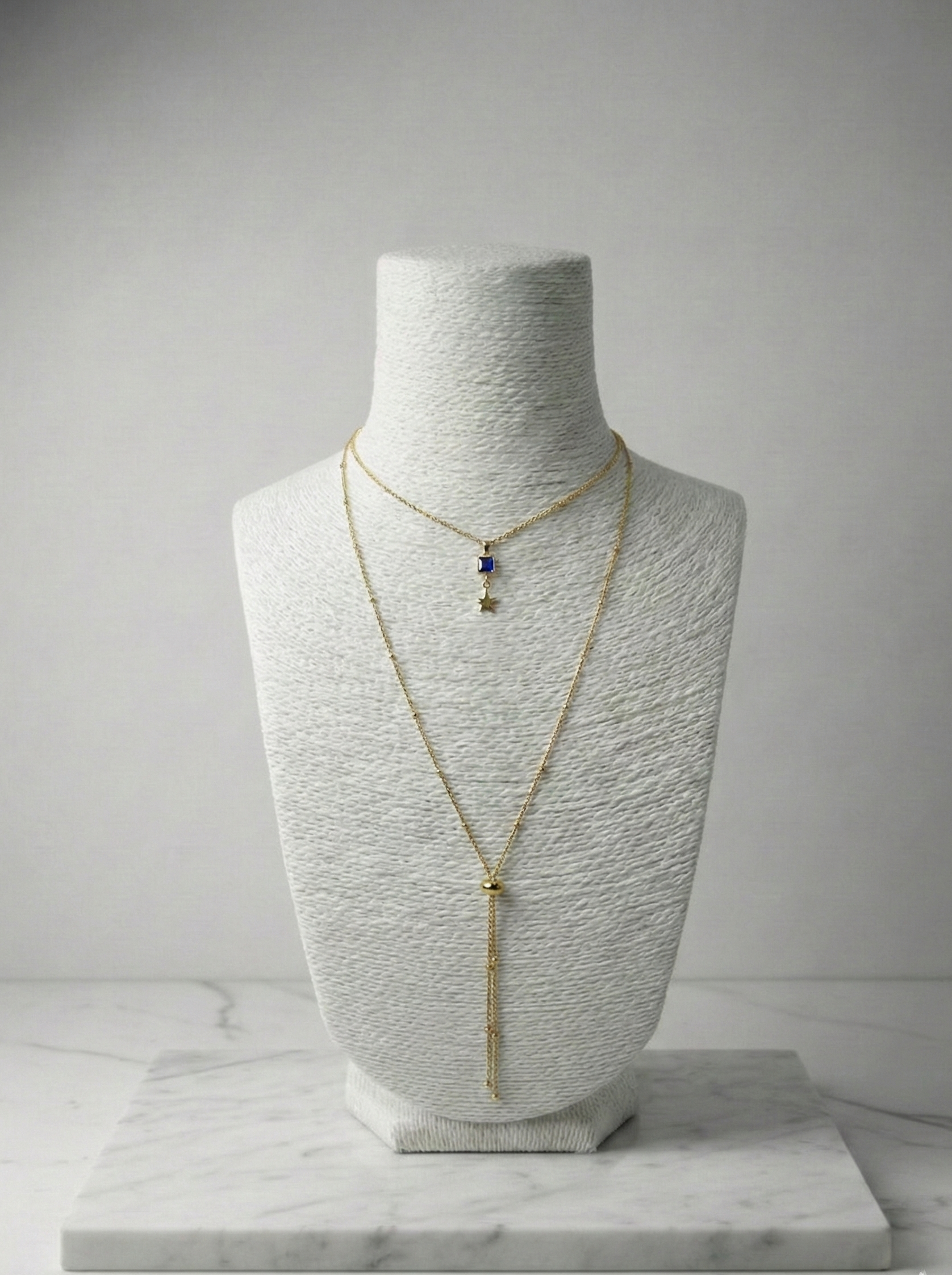 Mavi Baget Taşlı ve Kutup Yıldızı Uçlu Altın Rengi İkili Kolye